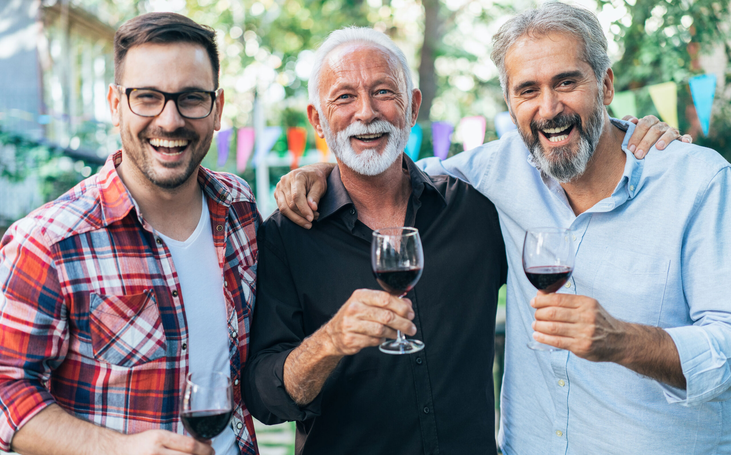 Three guys enjoying wine